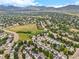 The aerial view showcases a vibrant community nestled against a backdrop of majestic mountains, with easy access to nearby highways at 11845 W Tulane Dr, Morrison, CO 80465