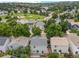 An aerial view of a home with a deck, trees, and a view of the neighborhood at 11845 W Tulane Dr, Morrison, CO 80465