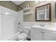 Cozy bathroom with tiled shower/tub, vanity, and stylish decor at 11845 W Tulane Dr, Morrison, CO 80465