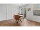 Bright dining area features modern furnishings, patio access, and a neutral palette at 11845 W Tulane Dr, Morrison, CO 80465