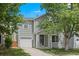Charming two-story home featuring a well-maintained front yard, attached garage, and classic curb appeal at 11845 W Tulane Dr, Morrison, CO 80465