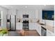 The kitchen has stainless steel appliances, granite countertops and white cabinets at 11845 W Tulane Dr, Morrison, CO 80465