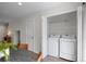 Convenient laundry area includes washer, dryer, and built-in storage at 11845 W Tulane Dr, Morrison, CO 80465