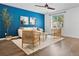 Cozy living room space with a ceiling fan and nice natural lighting from a window at 11845 W Tulane Dr, Morrison, CO 80465