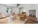 Bright living room showcasing hardwood floors and large windows at 11845 W Tulane Dr, Morrison, CO 80465