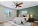 Inviting main bedroom showcases a striking accent wall and modern ceiling fan at 11845 W Tulane Dr, Morrison, CO 80465