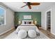 Serene main bedroom boasts stylish accents, soft textures, and ample natural light at 11845 W Tulane Dr, Morrison, CO 80465