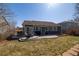 Cozy backyard with a concrete patio perfect for outdoor seating and entertaining, with a well-maintained lawn at 275 Gold Maple St, Brighton, CO 80601