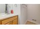 Bathroom features a single sink with light wood cabinetry and a mirrored backsplash at 275 Gold Maple St, Brighton, CO 80601