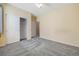 Bedroom featuring carpet, neutral paint, and a closet for optimal storage and functionality at 275 Gold Maple St, Brighton, CO 80601