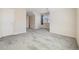 Bright, empty bedroom with clean carpeting and a sunny window at 275 Gold Maple St, Brighton, CO 80601