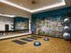 Bright gym with wood floors, large mirror, yoga mats, and fitness accessories at 275 Gold Maple St, Brighton, CO 80601