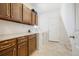 Well-organized laundry room with ample storage and modern appliances at 275 Gold Maple St, Brighton, CO 80601