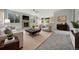 Bright living room with a fireplace, stylish decor, and comfortable seating arrangements at 275 Gold Maple St, Brighton, CO 80601