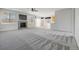 Spacious open-concept living room featuring a fireplace and seamless flow to the kitchen at 275 Gold Maple St, Brighton, CO 80601