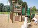 Community playground with climbing structures, slides, and soft landing surface at 275 Gold Maple St, Brighton, CO 80601
