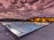 Community pool area featuring a large pool with lane markers and surrounding lounge area at 275 Gold Maple St, Brighton, CO 80601