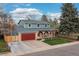 Charming two-story home with a well-manicured lawn and eye-catching brick and siding exterior at 6930 S Yukon Way, Littleton, CO 80128
