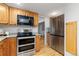 Modern kitchen with stainless steel appliances and plenty of cabinet space at 6930 S Yukon Way, Littleton, CO 80128