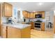 Well-lit kitchen featuring granite countertops, stainless steel appliances, and hardwood floors at 6930 S Yukon Way, Littleton, CO 80128