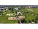 Aerial view of community amenities, including large park, playground, and pond at 4806 Jericho Ct, Denver, CO 80249