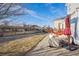 Landscaped backyard with patio and deck, perfect for outdoor entertaining at 4806 Jericho Ct, Denver, CO 80249