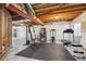 Finished basement with home gym, including weight machine and treadmill at 4806 Jericho Ct, Denver, CO 80249