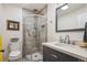 Updated bathroom with modern vanity, shower, and new fixtures at 4806 Jericho Ct, Denver, CO 80249