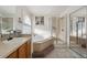 Elegant bathroom with a large soaking tub, shower, and double vanity at 4806 Jericho Ct, Denver, CO 80249