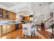 Eat-in kitchen with island, hardwood floors, and ample cabinetry at 4806 Jericho Ct, Denver, CO 80249