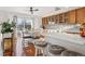 Bright kitchen with island, hardwood floors, and view to backyard at 4806 Jericho Ct, Denver, CO 80249
