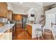 Kitchen with island, hardwood floors, and white quartz countertops at 4806 Jericho Ct, Denver, CO 80249