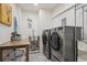 Laundry room with washer, dryer, and utility sink at 4806 Jericho Ct, Denver, CO 80249