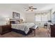 Bright and airy primary bedroom with a king-size bed and ensuite bath at 4806 Jericho Ct, Denver, CO 80249