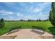 Community park with benches overlooking grassy fields and playground at 4806 Jericho Ct, Denver, CO 80249