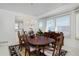 Elegant dining room with chandelier, large windows and adjacent access to the kitchen at 2713 Slate Ct, Superior, CO 80027