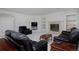 Comfortable living room featuring a fireplace and built-in shelves at 2713 Slate Ct, Superior, CO 80027