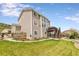 Beautiful backyard featuring a spacious lawn, multi-level deck, and serene landscaping for outdoor enjoyment at 6950 Blue Mesa Ln, Littleton, CO 80125