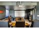 Cozy home theater features a projector, large screen, speakers, and comfortable seating for an immersive viewing experience at 6950 Blue Mesa Ln, Littleton, CO 80125