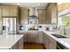 Well-equipped kitchen featuring quartz countertops, stainless steel appliances, and an island at 6950 Blue Mesa Ln, Littleton, CO 80125