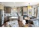 Modern kitchen featuring stainless steel appliances, stylish cabinets and eat in kitchen area at 6950 Blue Mesa Ln, Littleton, CO 80125