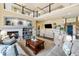 A welcoming living room with a fireplace, complemented by neutral tones and a cozy seating arrangement at 6950 Blue Mesa Ln, Littleton, CO 80125