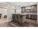 Finished basement with a wet bar, custom cabinets, and recessed lighting at 2880 Emporia Ct, Denver, CO 80238