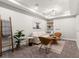 Finished basement with living room seating and decorative shelves at 2880 Emporia Ct, Denver, CO 80238