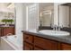 Beautiful bathroom boasts soaking tub, double sinks, and a large glass shower at 2880 Emporia Ct, Denver, CO 80238