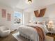Cozy bedroom bathed in natural light with stylish decor and comfortable furnishings at 2880 Emporia Ct, Denver, CO 80238