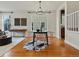 Cozy dining area featuring hardwood floors and a modern chandelier at 2880 Emporia Ct, Denver, CO 80238