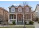 Charming two-story home with a covered front porch and well-maintained lawn at 2880 Emporia Ct, Denver, CO 80238