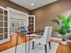 Spacious office featuring French doors, wood floors, and a decorative plant at 2880 Emporia Ct, Denver, CO 80238