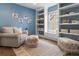 Cheerful playroom with built-in shelving, window seat and charming decor at 2880 Emporia Ct, Denver, CO 80238